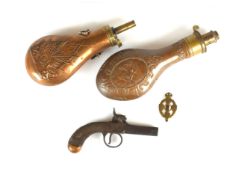 A percussion pocket pistol and two powder flasks