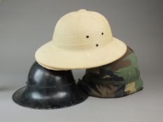 Civil Defence helmet, post-war helmet and pith helmet