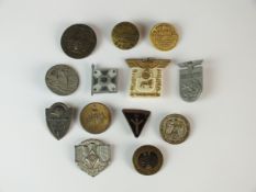 Thirteen German badges and tinnies
