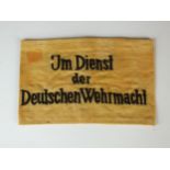 A German WW2 'Im Dienst Der Deutschen Wehrmacht' Armband. worn by non-military & non-German