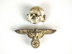 A reproduction German SS cap badge skull and eagle