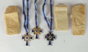 A set of three German Third Reich Mother's Crosses, ex Deschler hoard.