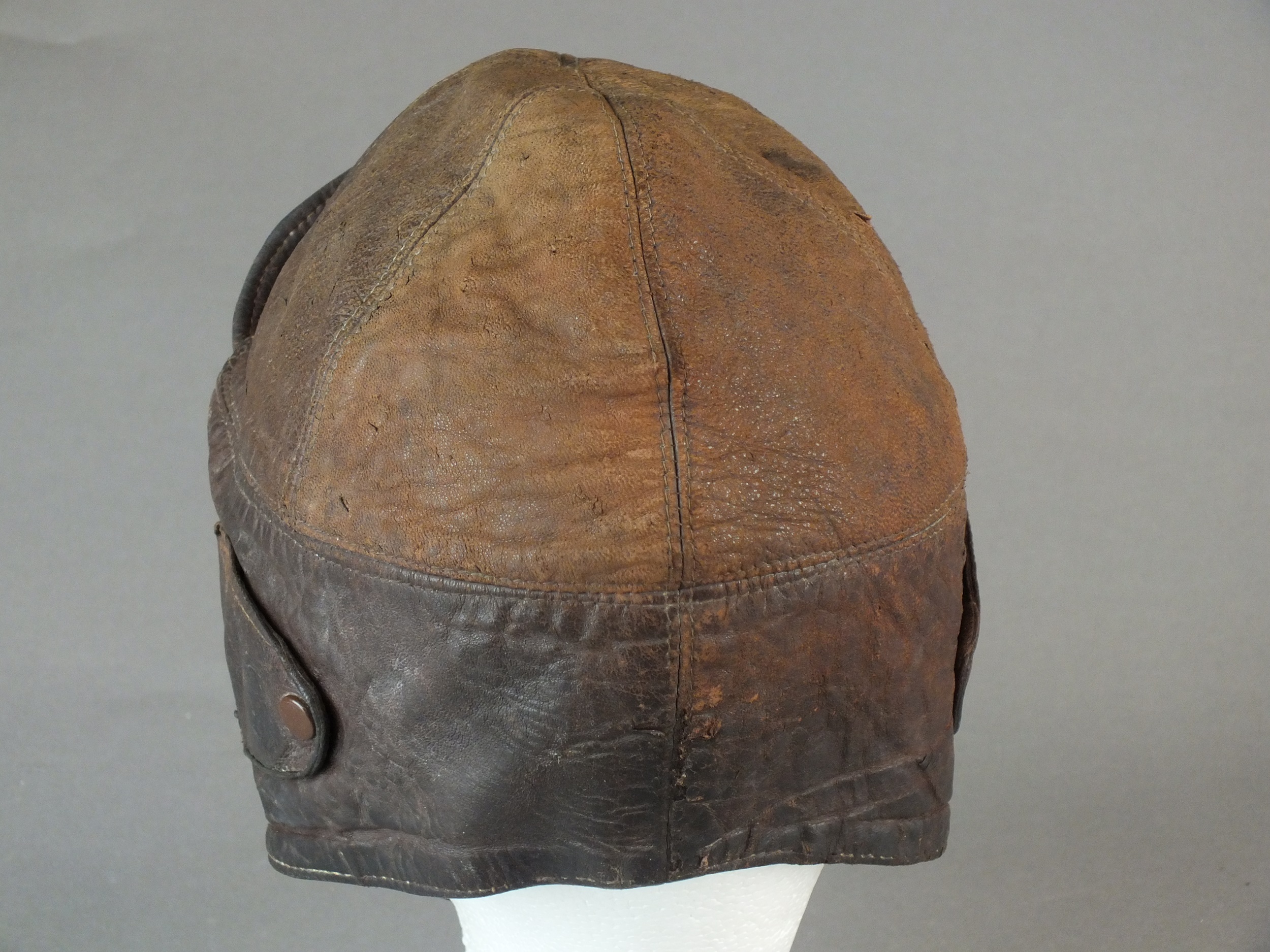 A British early leather Flying Helmet or Motoring helmet, probably WW1-era brown leather with wool- - Image 2 of 6