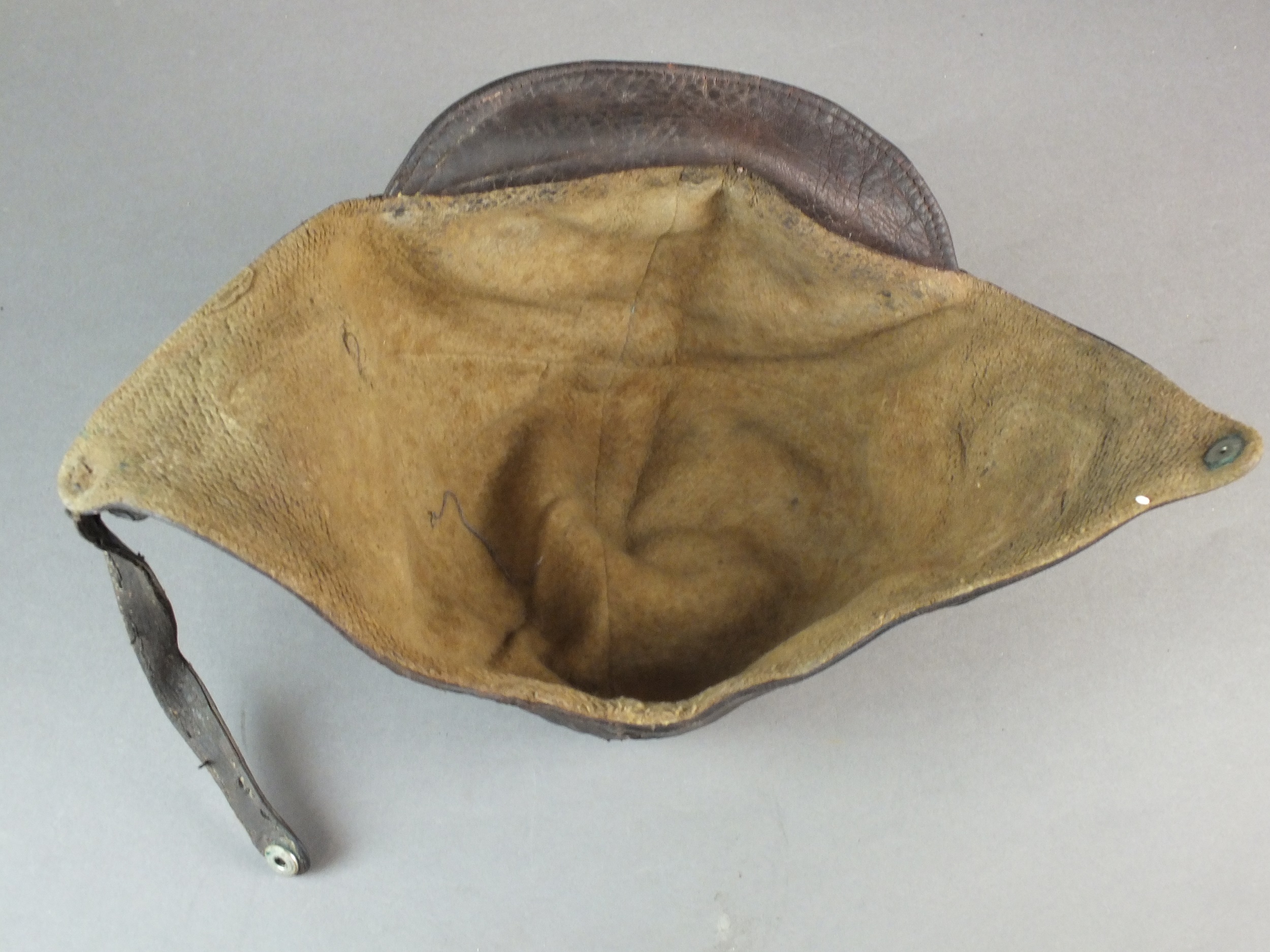 A British early leather Flying Helmet or Motoring helmet, probably WW1-era brown leather with wool- - Image 6 of 6