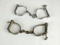 Two pairs of "D-Type" handcuffs by Hiatt and Dowler