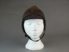 A British early leather Flying Helmet or Motoring helmet, probably WW1-era brown leather with wool-