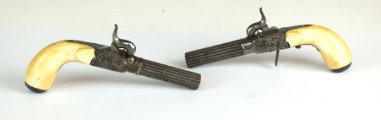 A good pair of French or Belgian percussion pocket pistols, mid-19th century