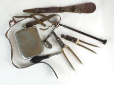 A collection of antique gunsmith tools including bullet moulds, nipple wrench, James Dixon gun oil