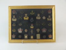 A group of framed bullion badges
