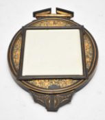 A late 19th century, Aesthetic period, ebonised and gilded wall mirror