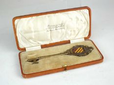Walter Gilbert (British, 1871-1946), a Bromsgrove Guild enamelled bronze presentation key