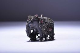 An Indian inlaid and jewelled ebony elephant candle holder