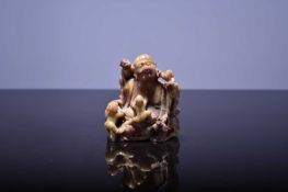 A Chinese soapstone figure of Budai, Qing Dynasty