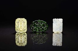 An assembled group of Chinese jade and serpentine pendants