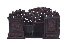 A Japanese carved wood wall hanging cabinet