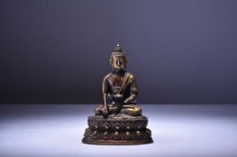 A Sino-Tibetan bronze figure of a seated Bhudda