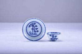 A Chinese blue and white tea bowl and saucer from the Nanking cargo