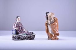 A Chinese famille rose figure of a maiden and a Shiwan figure of Shoulao