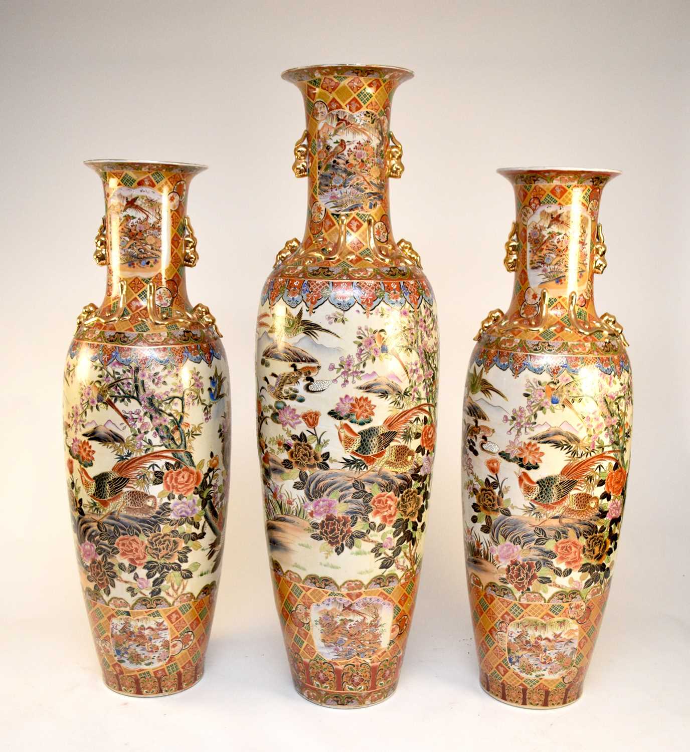 A garniture of three very large Kutani-style floor vases, post-war