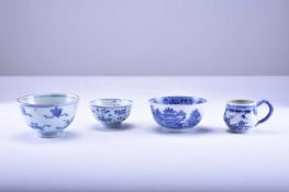 An assembled group of Chinese blue and white bowls and a cup, 18th century