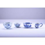 An assembled group of Chinese blue and white bowls and a cup, 18th century