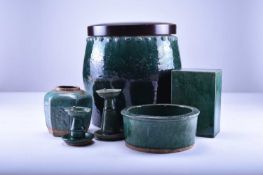 An assembled group of Chinese Shiwan green-glazed pottery, late Qing Dynasty