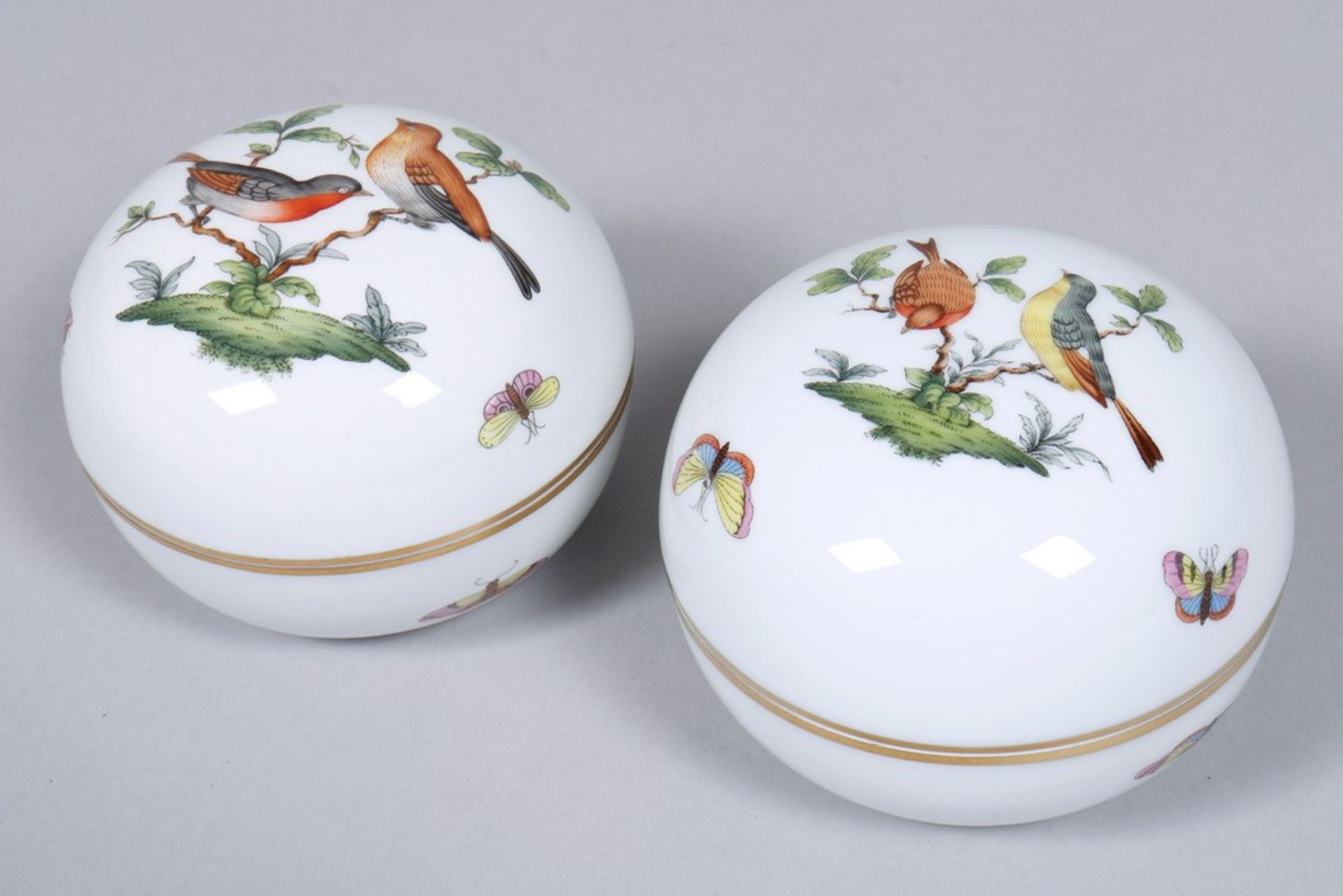 Pair of round lidded boxes, Herend, Hungary, "Rothschild" decor, 20th C.