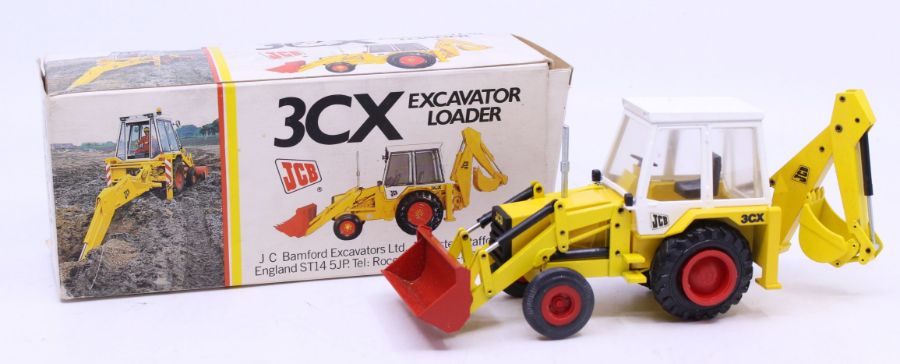 NZG: A boxed NZG Models, 3CX Excavator Loader, No. 216. Original illustrated box. Slight damage to