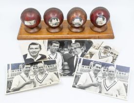 An impressive group of mounted cricket balls, each commemorating a significant landmark of Derek
