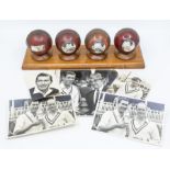 An impressive group of mounted cricket balls, each commemorating a significant landmark of Derek