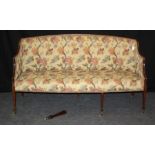 A 19th century mahogany framed, floral tapestry upholstered three person salon settee with padded