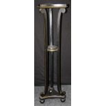 A 19th century ebonized and gilt painted urn stand, the concave triform top on elongated scroll