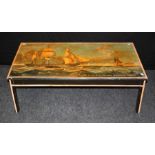 A mid 20th century painted wood coffee level table, the rectangular top decorated with the ship