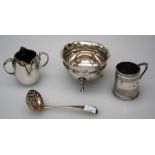 S W Smith and Co, an Edwardian silver twin handled double lipped jug, London 1902, a Christening mug