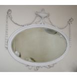 A 19th century carved wood and gesso wall mirror in the Adam style with swagged urn over a