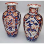 A pair of large, late 19th century/ early 20th century Japanese Imari vases of baluster form, each