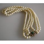 A triple row cultured pearl necklace of creamy white pearls with pink overtones, approx. 6.13mm -