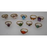 A collection of ten gem-set 9ct gold rings including opal, ruby and diamond, tanzanite, blue topaz