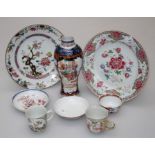 A group of 18th century and later famille rose wares including two plates, tea bowl, baluster form