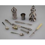 An early 19th century Old Sheffield Plate pepper of baluster form, another cylindrical pepper, a