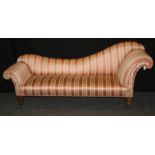 A Victorian double scroll ended chaise longue, recently upholstered in Regency stripe, with swept