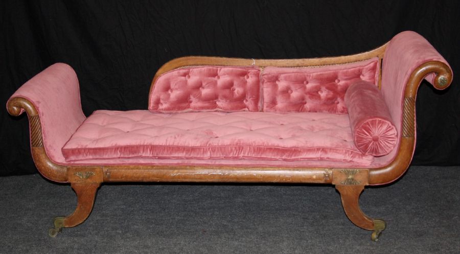 A Regency gilt metal mounted double scroll ended chaise longue, with bergere cane back, pale