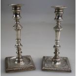 Edward Wakelin/ John Arnell, a matched pair of George III silver candlesticks, each having