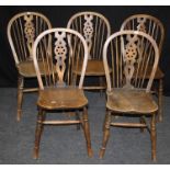 A set of five beech and ash Windsor wheelback chairs