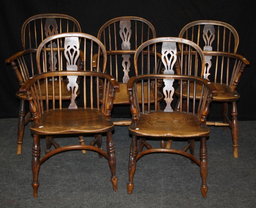 A pair of 19th century yew Windsor double hoop and stick back armchairs, each with elm saddle