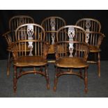 A pair of 19th century yew Windsor double hoop and stick back armchairs, each with elm saddle