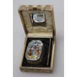 A cased silver mounted brush and comb with simulated enamel Chinoiserie decoration. Birmingham 1927