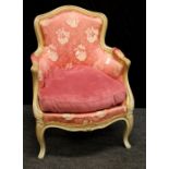 A 19th century French salon armchair with serpentine rail, padded back and downswept arms, sprung