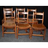 A set of six 19th century beech and elm school/chapel chairs, each having later painted number to