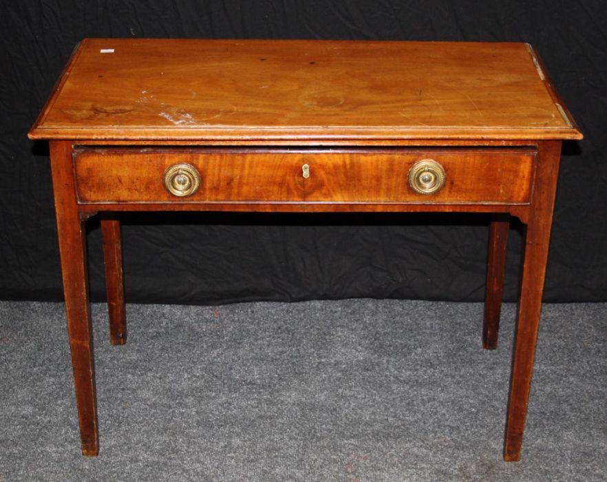 A late George III mahogany and satinwood banded side table fitted with a long frieze drawer raised